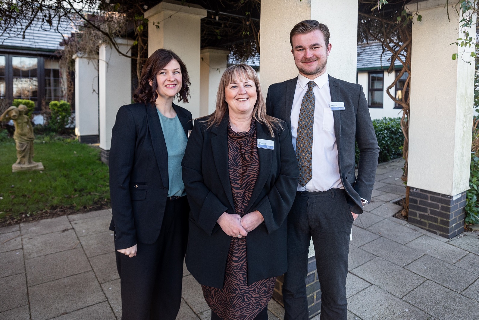 Lynn Porter & Harry Newton with Lancaster House Hotel general manager Emma Underwood (centre) NEC-32c1b828