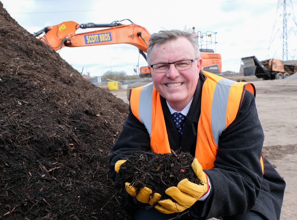 Bob Borthwick shows off a sample of compost