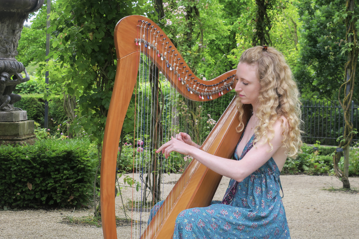 A harpist by the Sage Wealth Management Grand Cascade at The Alnwick Garden