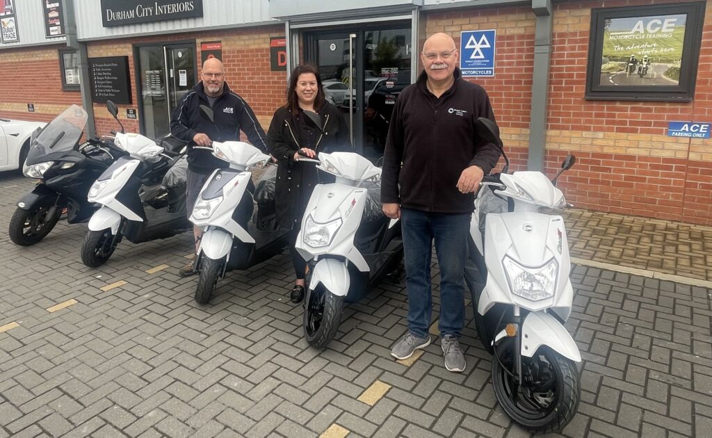 (from left) Jimmy Rimmer of Ace Motorcycle Training, Lucy Hinds of the Banks Group and Liam Weatherill of Wheels2Work County Durham