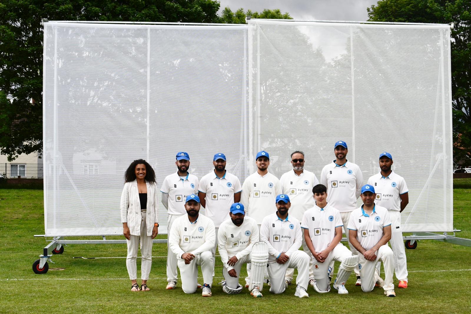 Newcastle City CC players with (back, right) Jamilah Hassan of the Banks Group
