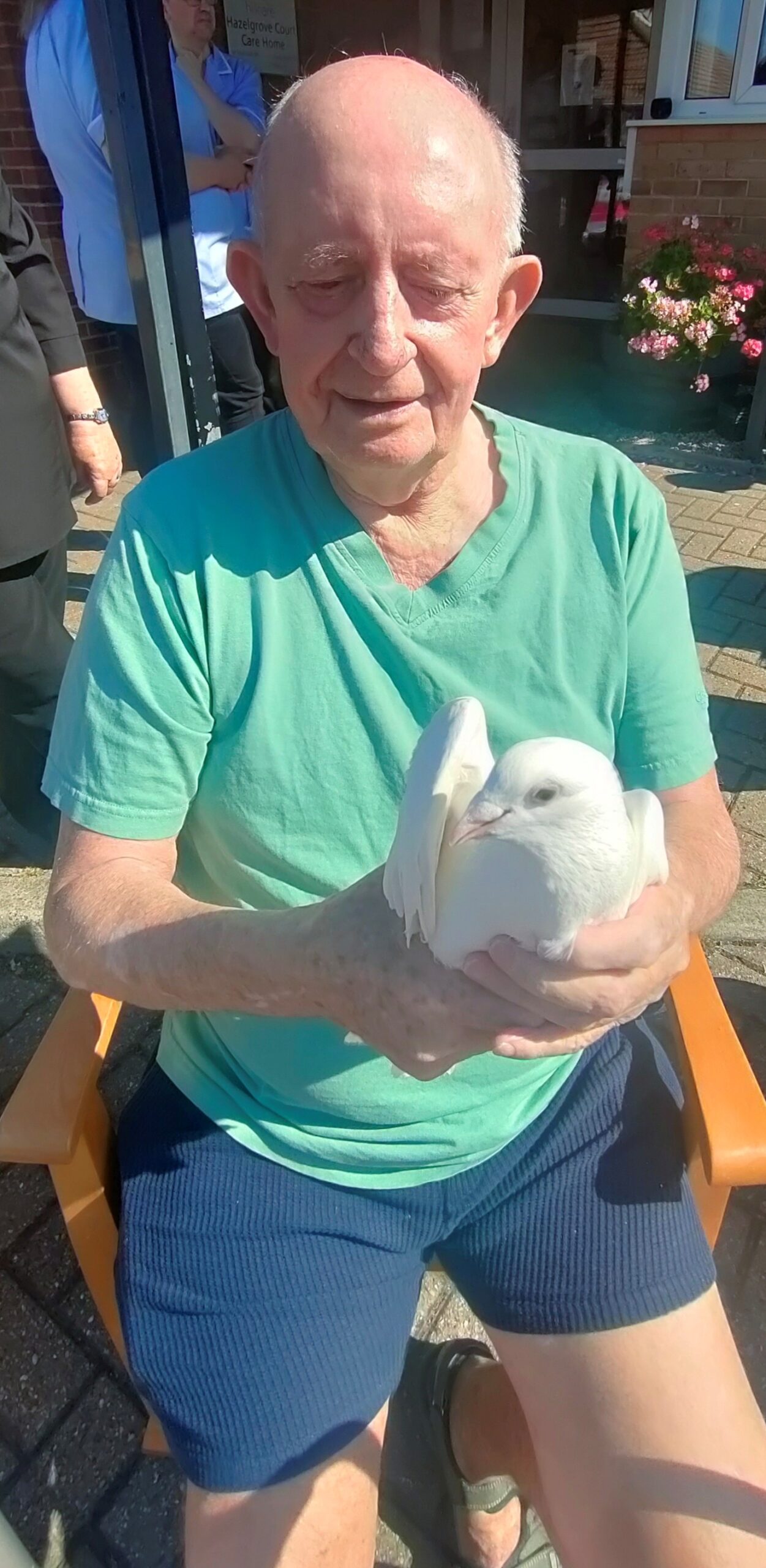 Hazelgrove Court Care Home resident David Rigg, 78, releases a dove to commemorate the 80th anniversary of VJ Day.